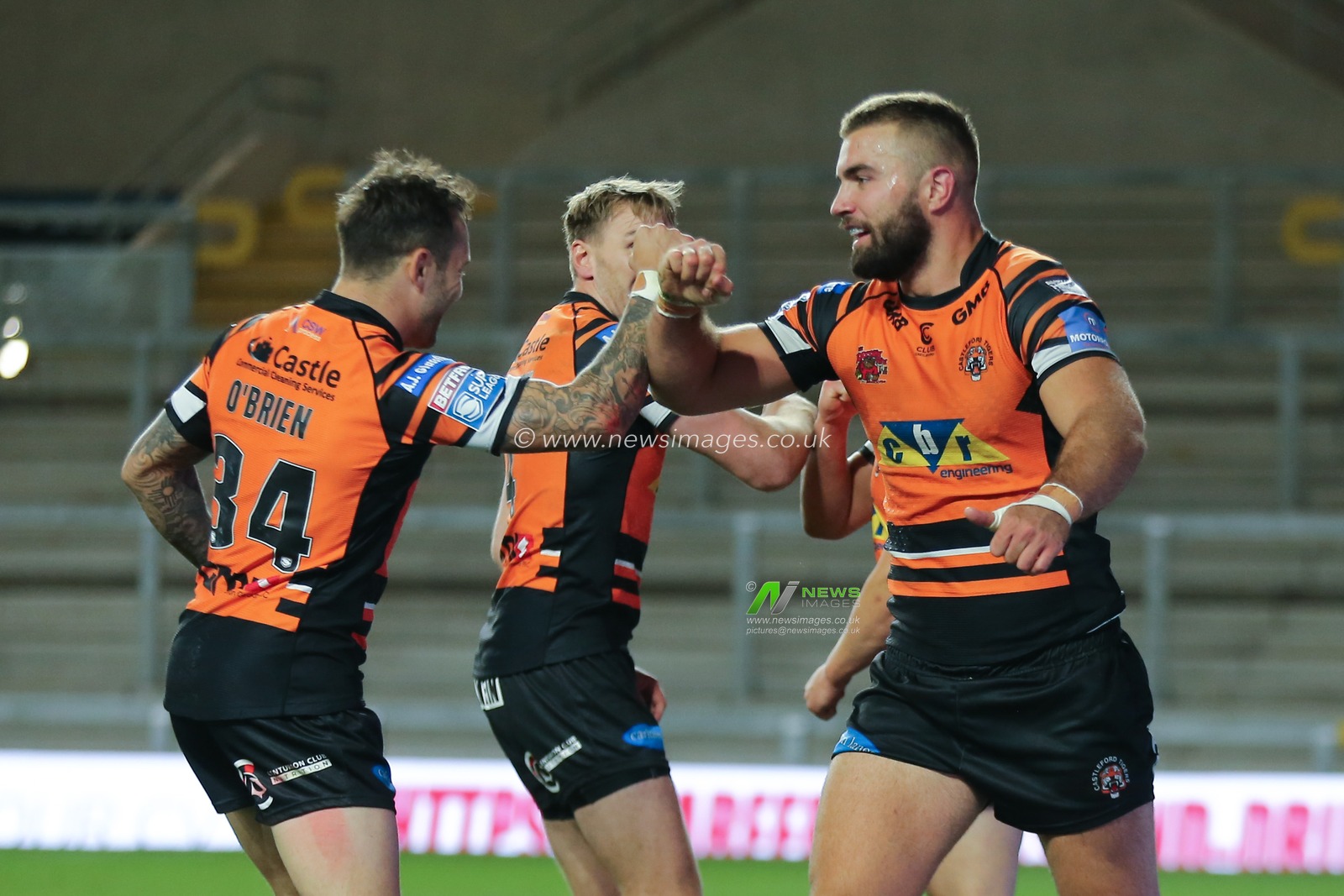 Mike McMeeken (12) of Castleford Tigers celebrates scoring his try with team mate Gareth Oâ€™Brien.