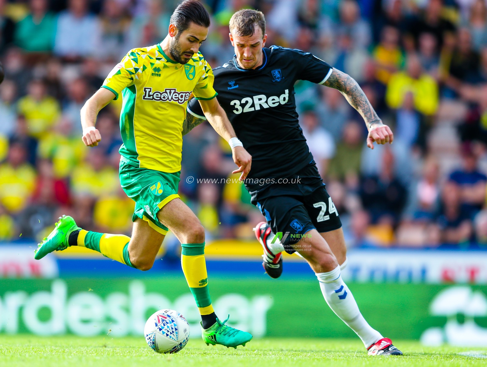 15th August 2018, Carrow Road, Norfolk, England; Sky Bet EFL Championship Norwich City v Middlesbrough ;  Aden Flint tracks Norwich's Mario Vrancic.



EDITORIAL USE ONLY No use with unauthorised audio, video, data, fixture lists, club/league logos or 'live' services. Online in-match use limited to 45 images, no video emulation. No use in betting, games or single club/league/player publications and all English Football League images are subject to DataCo Licence