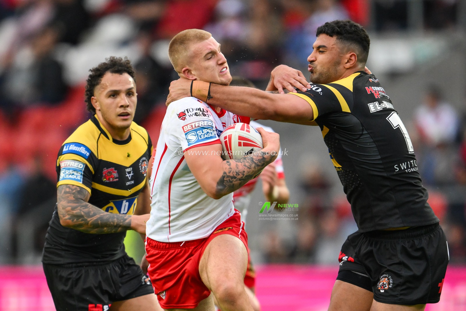 George Delaney of St. Helens is tackled by Elie El-Zakhem of Castleford Tigers during the Betfred Super League Round 16 match St Helens vs Castleford Tigers at Totally Wicked Stadium, St Helens, United Kingdom, 5th July 2024

(Photo by Craig Thomas/News Images)