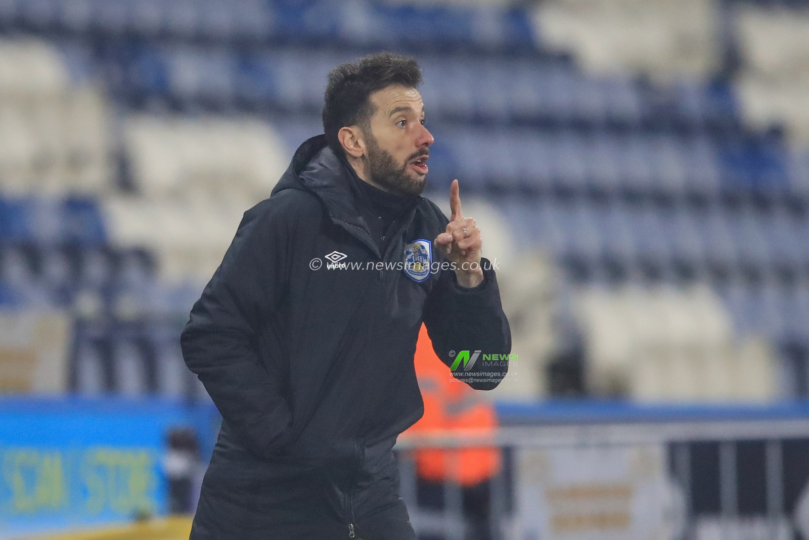 Carlos CorberÃ¡n manager of Huddersfield Town gives his team instructions
