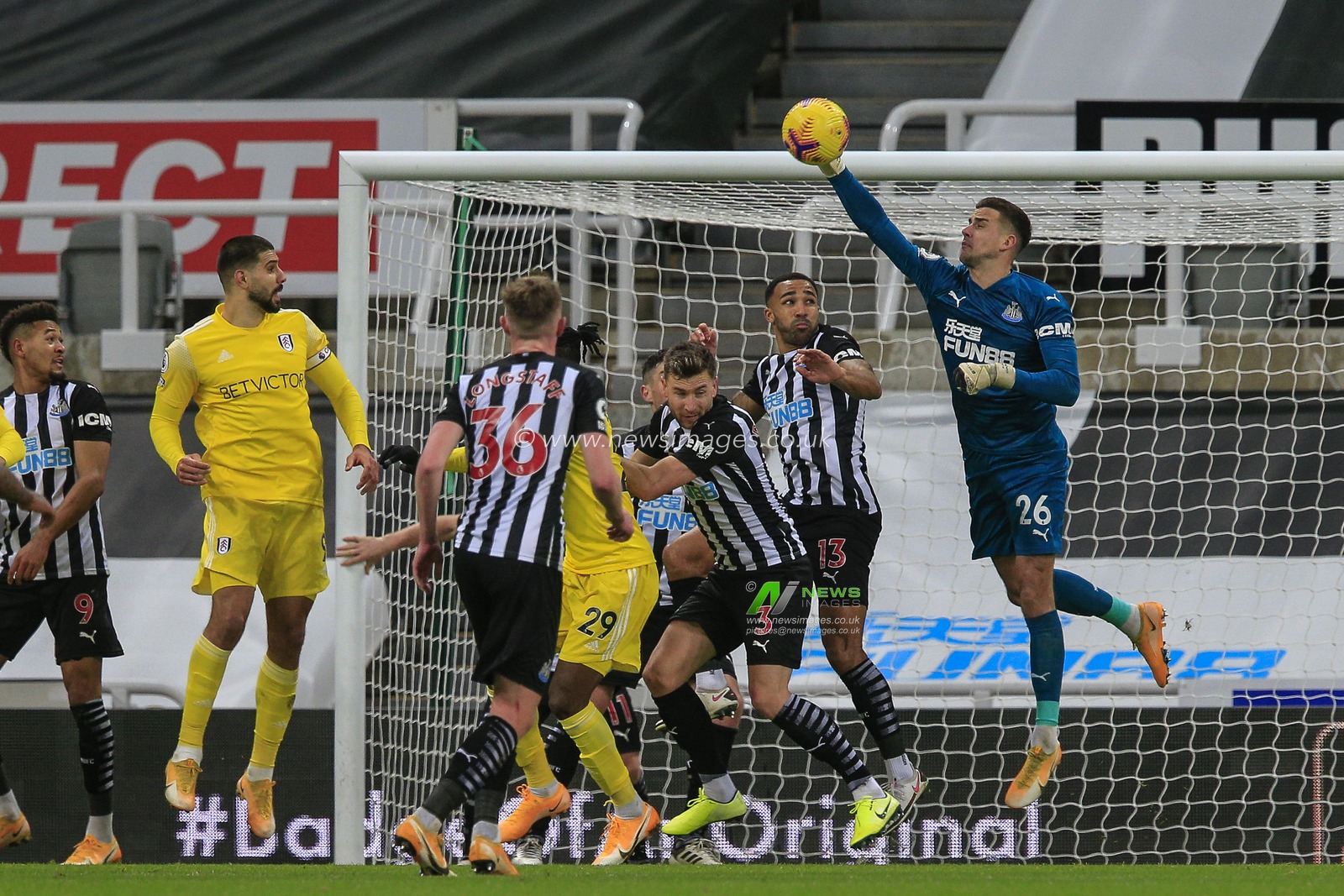 Karl Darlow #26 of Newcastle United punches the ball away
