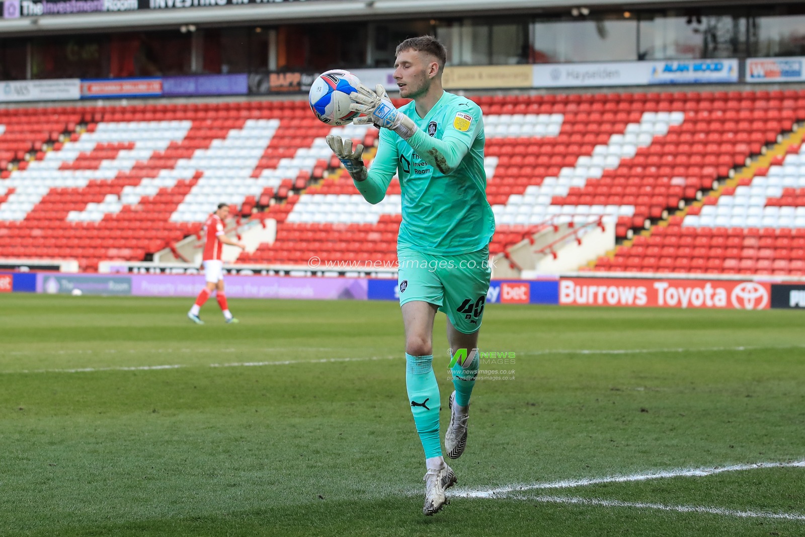 Bradley Collins #40 of Barnsley catches a soft shot on goal
