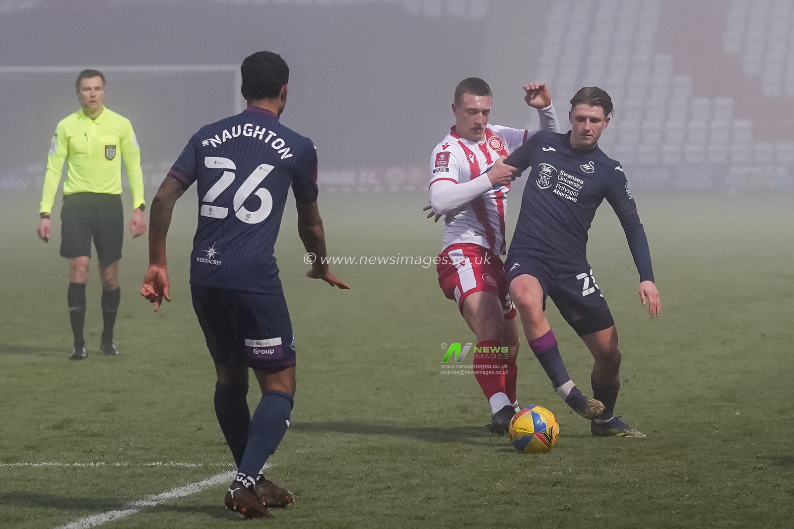 Luke Norris #36 of Stevenage battles with Kyle Naughton #26 of Swansea City