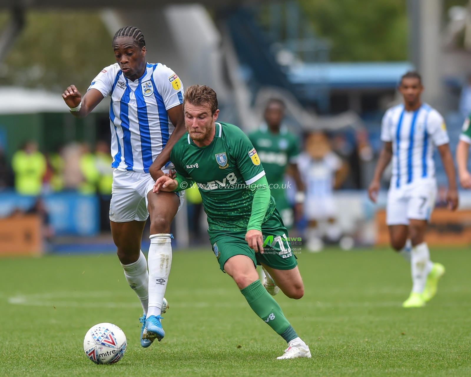 15th September 2019, John Smiths Stadium, Huddersfield England; Sky Bet Championship Football, Huddersfield Town vs Sheffield Wednesday ;Sam Winnall (11) of Sheffield Wednesday fends off Terence Kongolo (5) of Huddersfield Town.

Credit: Dean Williams/News Images

English Football League images are subject to DataCo Licence