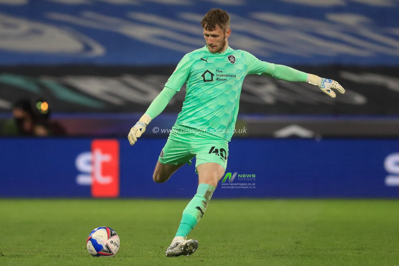 Bradley Collins #40 of Barnsley kicks the ball up field