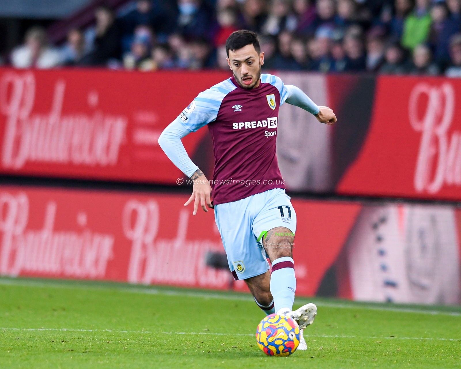 Dwight McNeil #11 of Burnley passes the ball