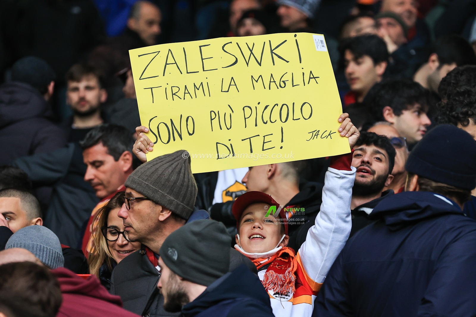 A Roma fans holds up a  banners up at The King Power Stadium, Home of Leicester City