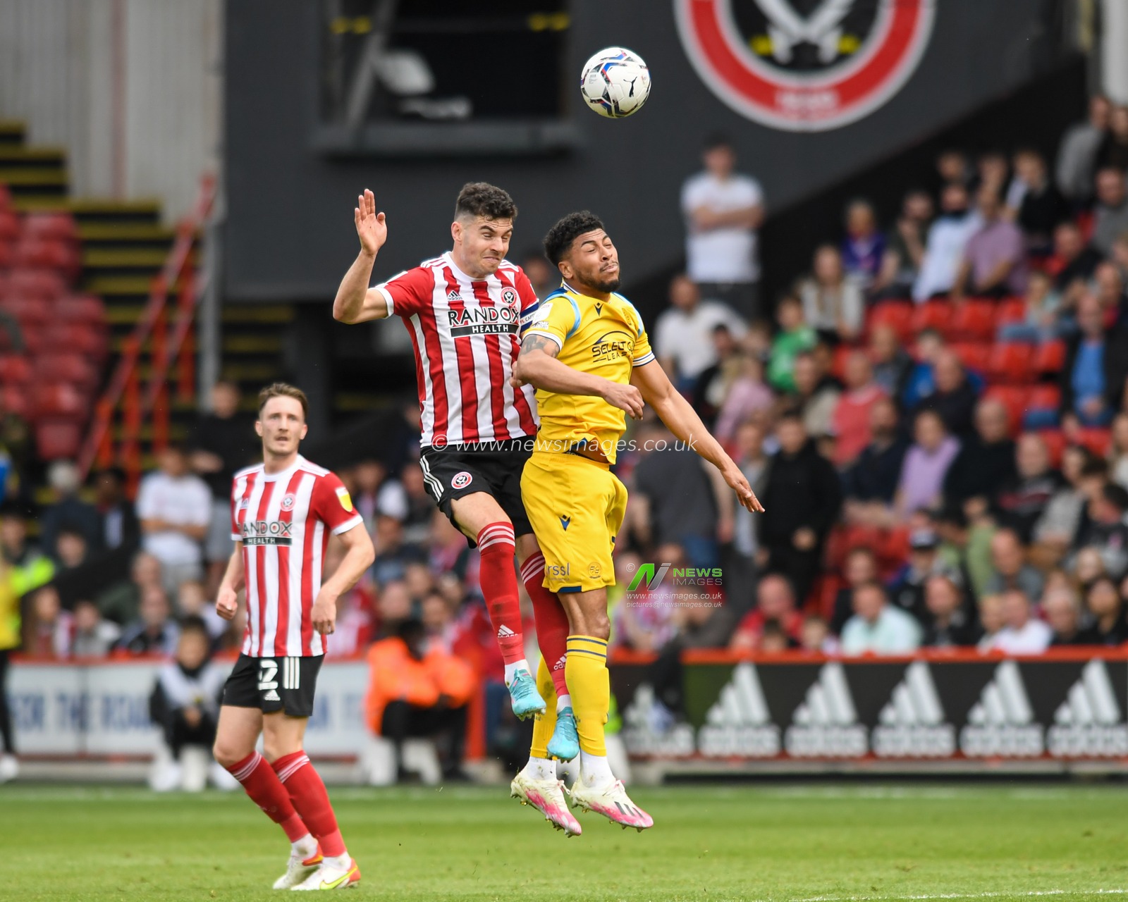 John Egan #12 of Sheffield United competes with Josh Laurent #28 of Reading for the ball