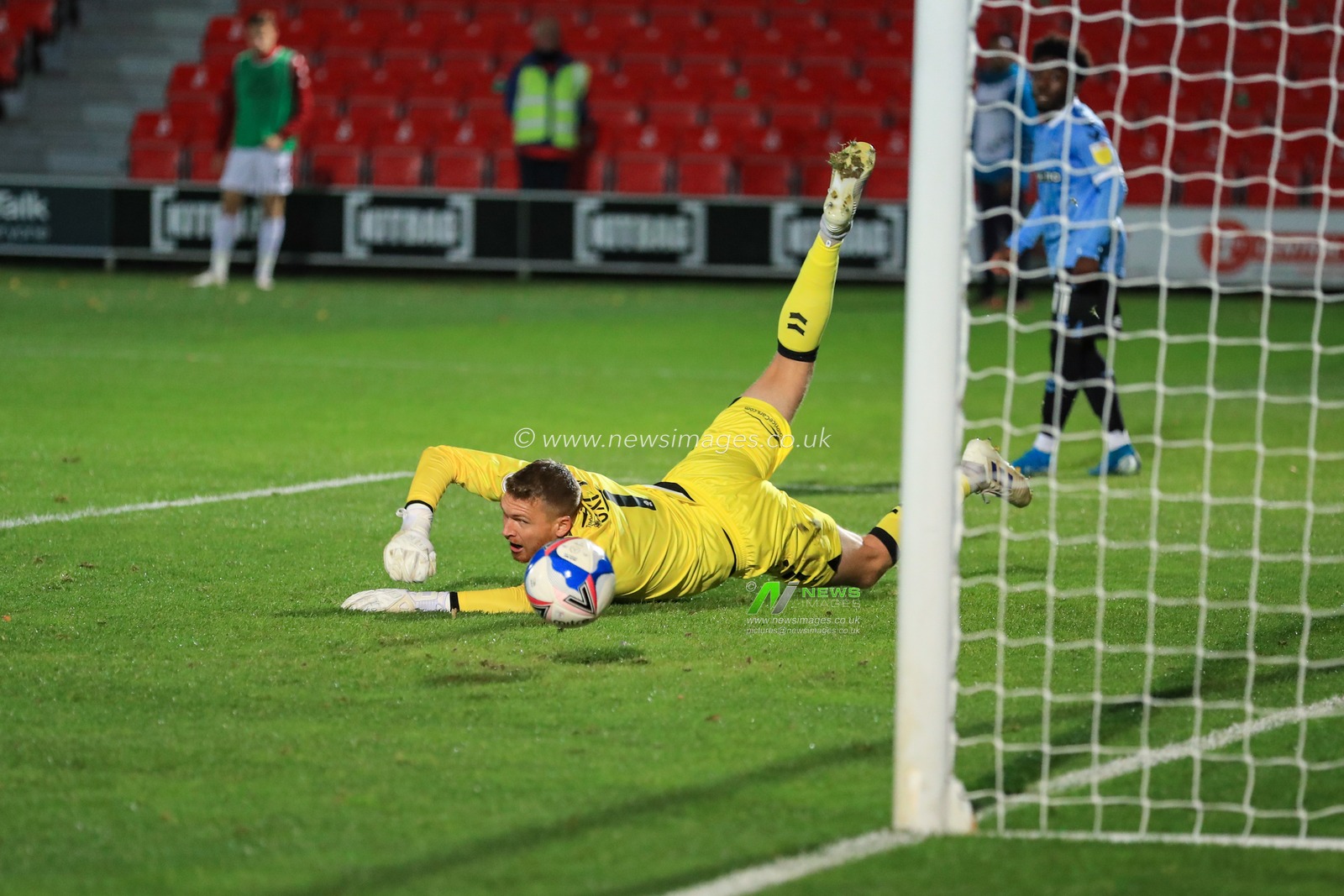 James Wilson (19) of Salford City scored past  Mark Oxley (1) of Southend United