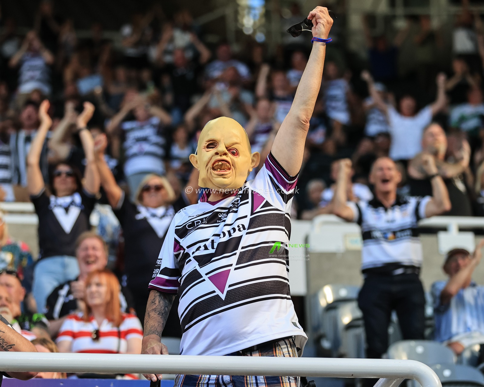 Hull FC fans celebrate Joe Lovodua #14 of Hull FCâ€™ try
