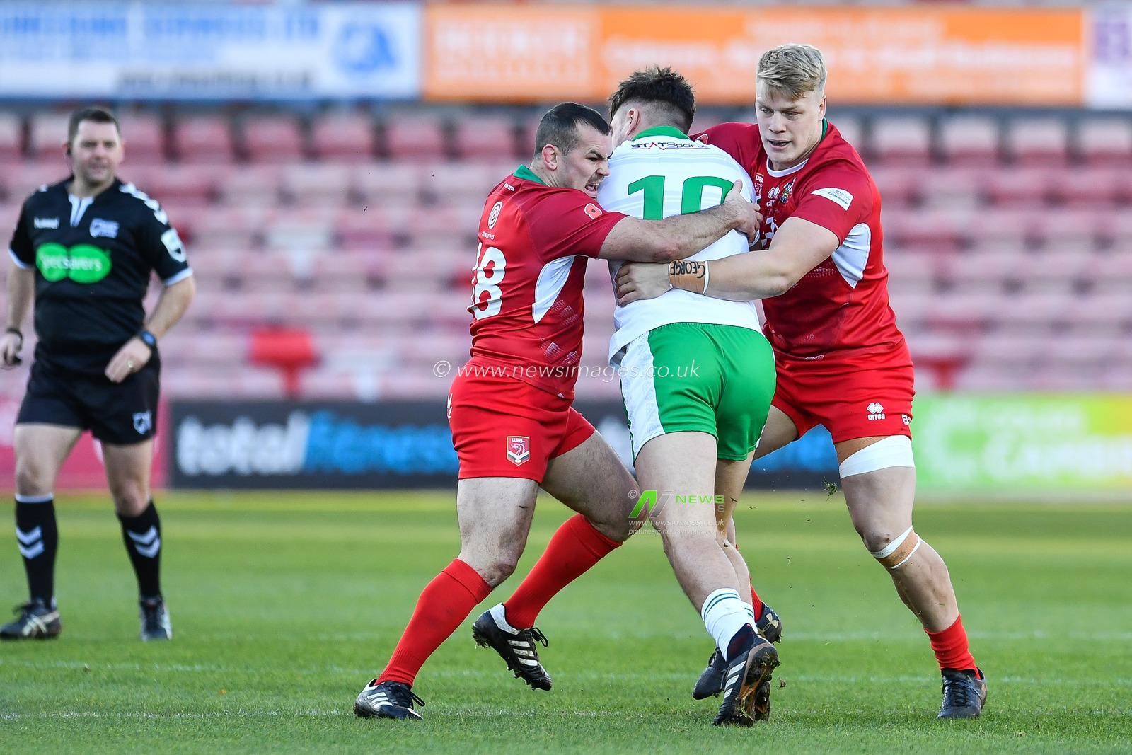 11th November 2018 , Racecourse Ground,  Wrexham, Wales ;  Rugby League World Cup Qualifier,Wales v Ireland ; Liam Byrne of Ireland is is tackled by Steve Parry of Wales 


Credit:   Craig Thomas/News Images
