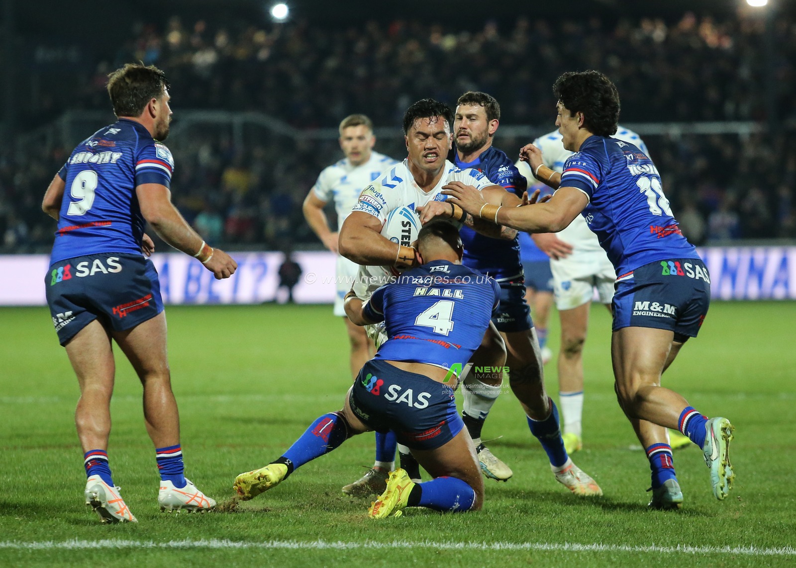 Reubenn Rennie of Toulouse Olympique is tackled by Corey Hall of Wakefield Trinity during the Betfred Super League Round 1 match Wakefield Trinity vs Toulouse Olympique at DIY Kitchens Stadium, Wakefield, United Kingdom on 14 February 2026

(Photo by Richard Bierton/News Images)