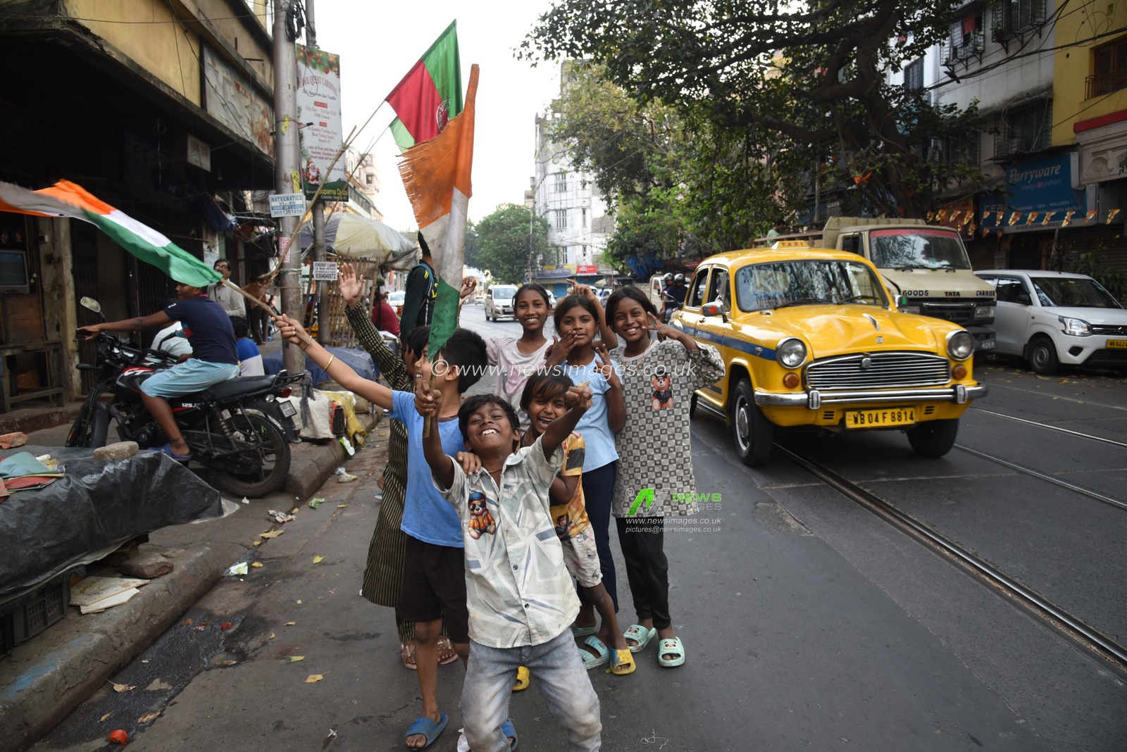 Indian fans celebrates with National Flgs of Champions Trophy 
Final match between India and New Zealand on LED TV, on March 9,2025 in Kolkata, India. Pictures by Debajyoti Chakraborty.(Photo: Debajyoti Chakraborty/News Images)