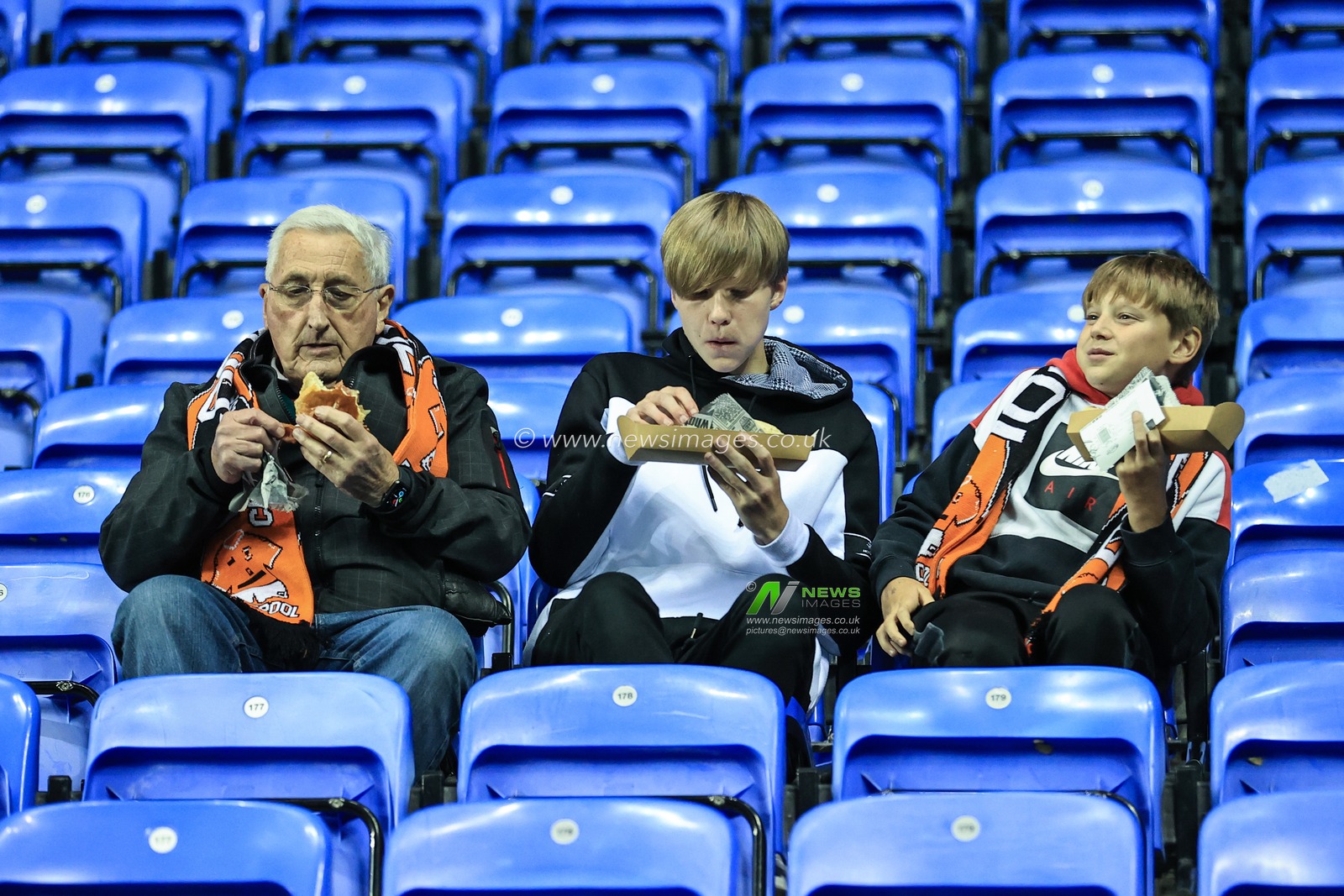 Blackpool fans grab a bite to eat as the arrive at the Select Car Leasing Stadium Reading