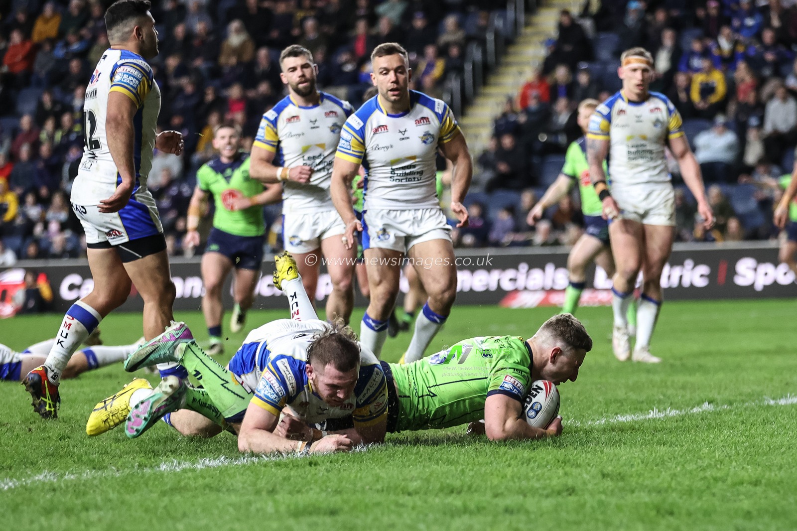George Williams of Warrington Wolves goes over for a try to make it during the Betfred Super League Round 7 match Leeds Rhinos vs Warrington Wolves at Headingley Stadium, Leeds, United Kingdom, 5th April 2024

(Photo by Mark Cosgrove/News Images)