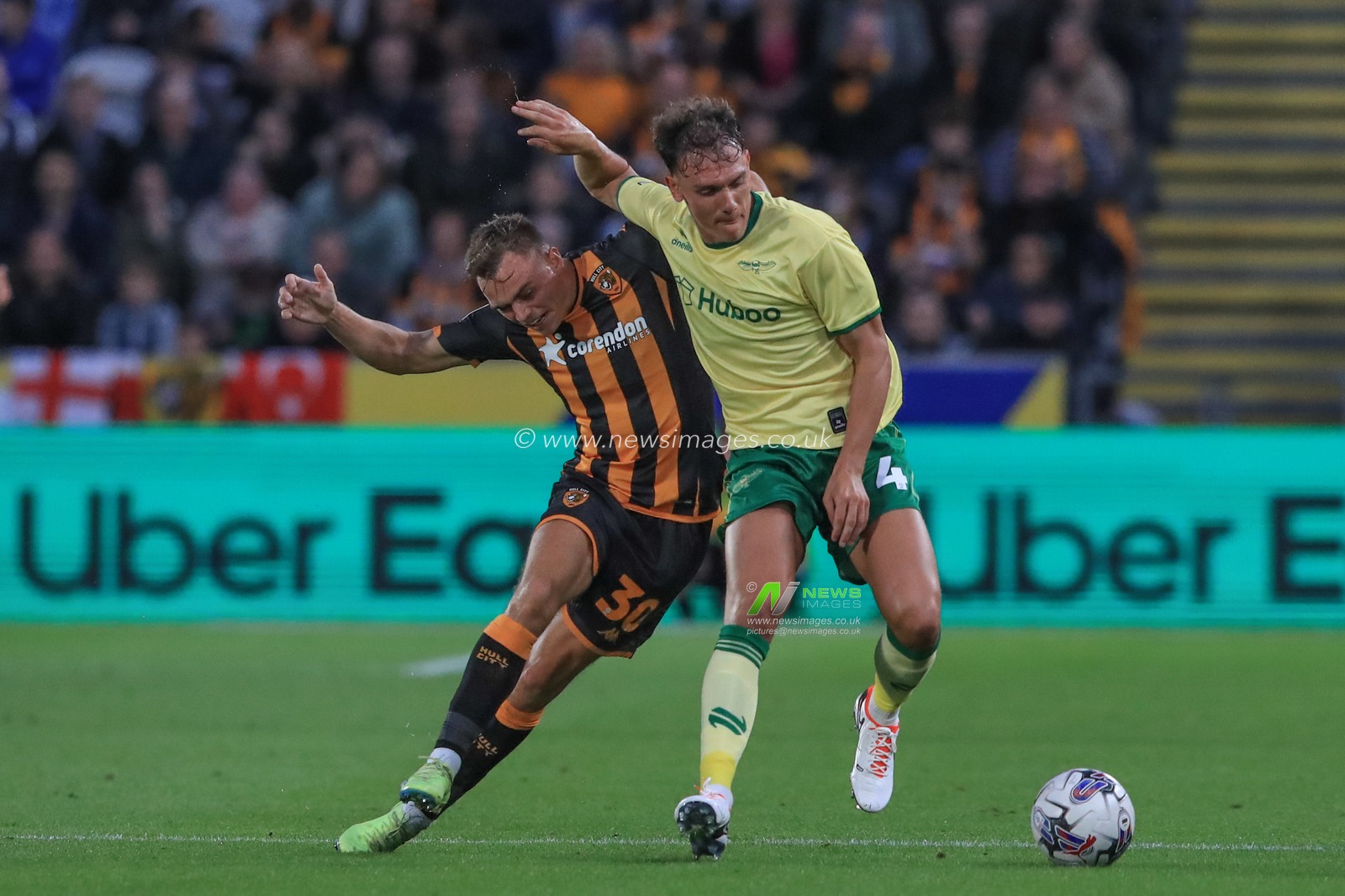 Scott Twine #30 of Hull City and Kal Naismith #4 of Bristol City battle for the ball during the Sky Bet Championship match Hull City vs Bristol City at MKM Stadium, Hull, United Kingdom, 25th August 2023

(Photo by Alfie Cosgrove/News Images)