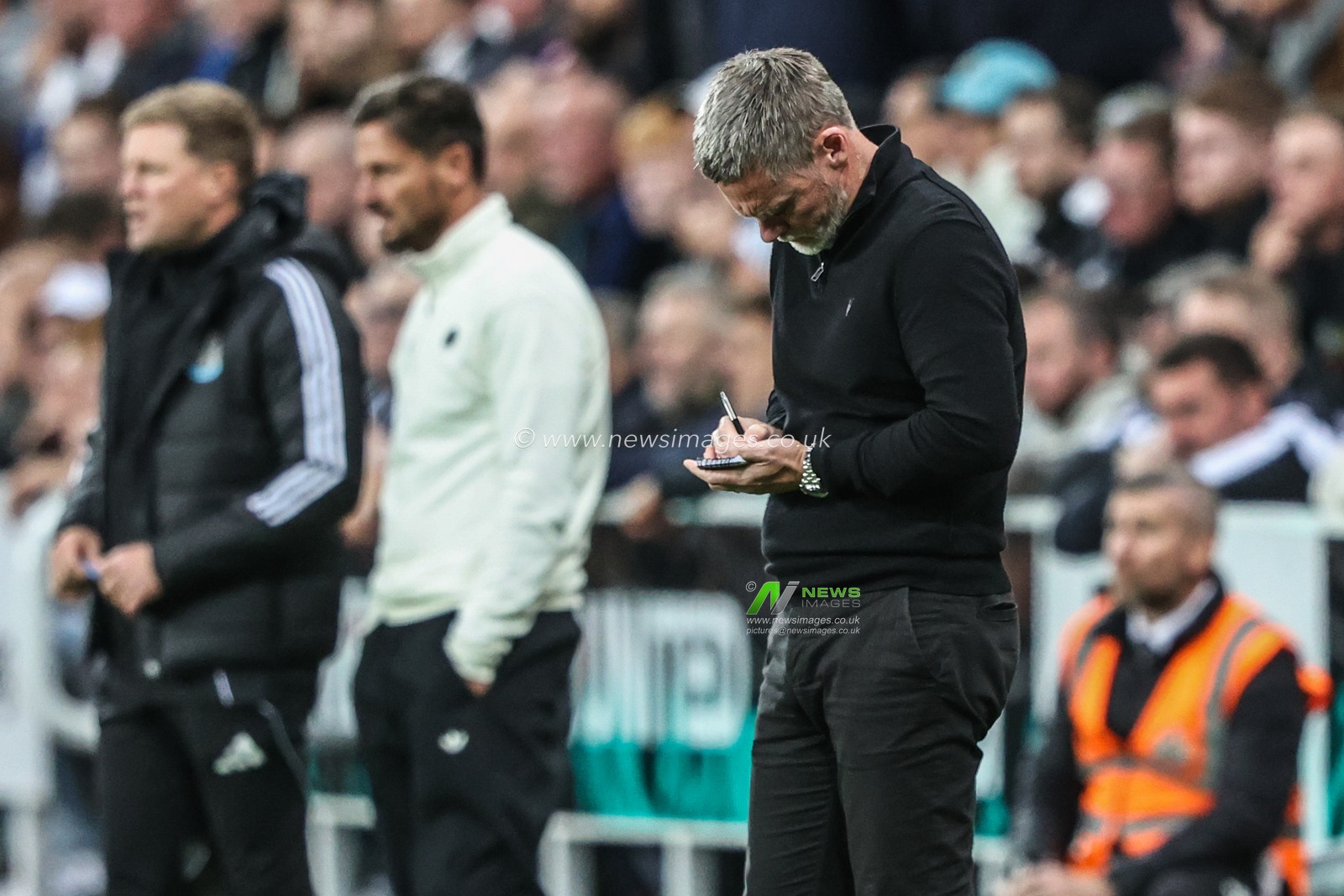 Graham Alexander manager of Bradford City writes in his notebook during the Carabao Cup Round 3 match Newcastle United vs Bradford City at St. James's Park, Newcastle, United Kingdom, 24th September 2025

(Photo by Alfie Cosgrove/News Images)