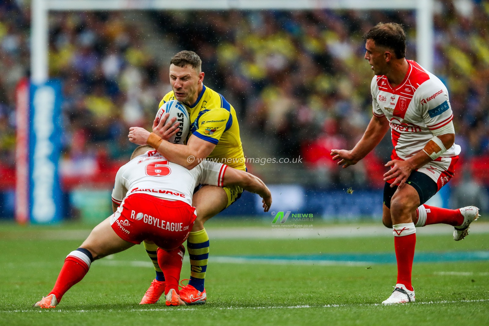 George Williams of Warrington Wolves is tackled during the Betfred Challenge Cup Final Warrington Wolves vs Hull KR at Wembley Stadium, London, United Kingdom, 7th June 2025

(Photo by Izzy Poles/News Images)