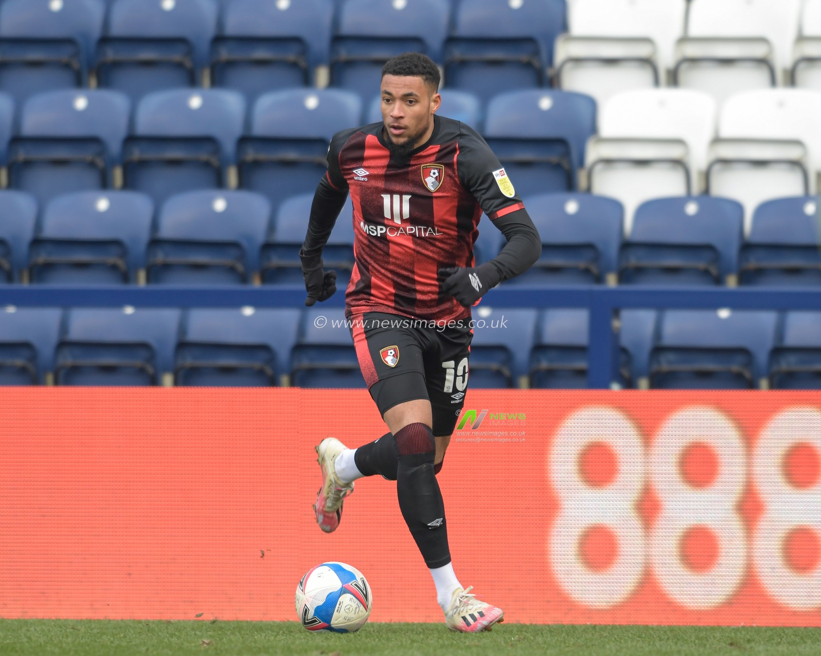 Arnaut Danjuma #10 of Bournemouth runs with the ball