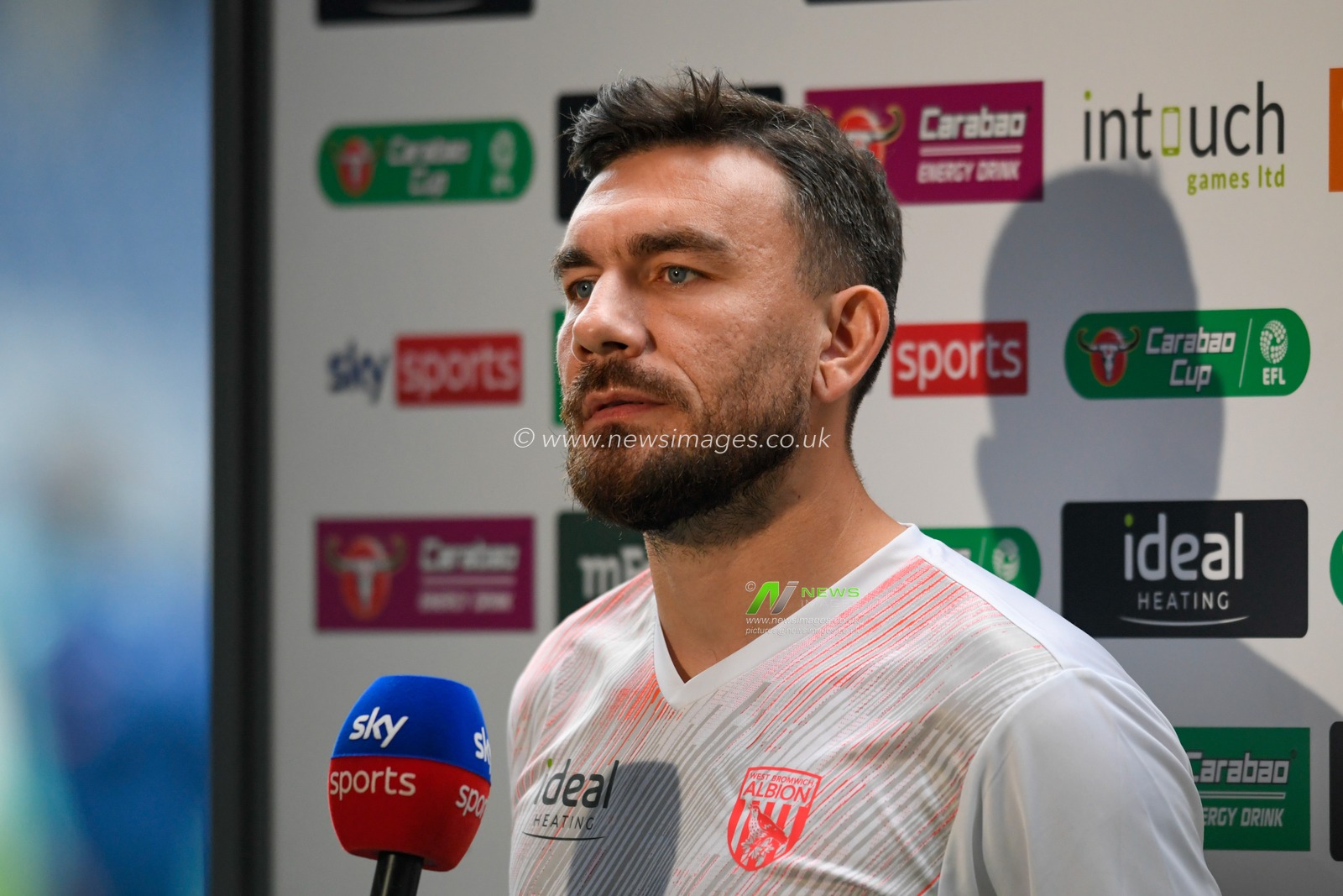 Robert Snodgrass #23 of West Bromwich Albion speaks to the media before the game