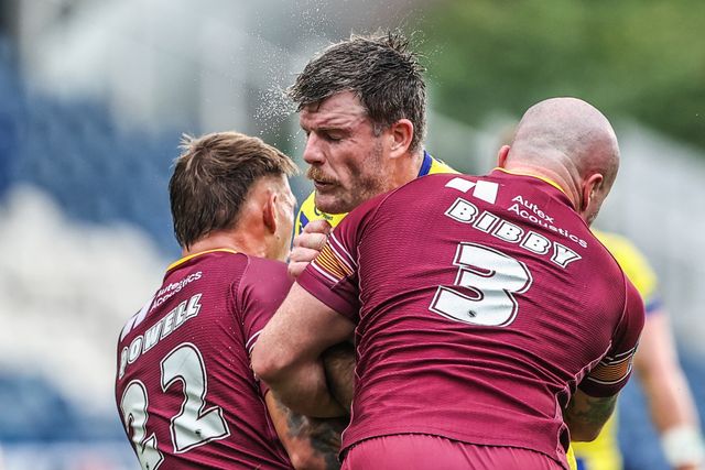 Lachlan Fitzgibbon of Warrington Wolves is tackled by Jake Bibby of Huddersfield Giants during the Betfred Super League Round 23 match Huddersfield Giants vs Warrington Wolves at Accu Stadium, Huddersfield, United Kingdom, 24th August 2025

(Photo by Alfie Cosgrove/News Images)
