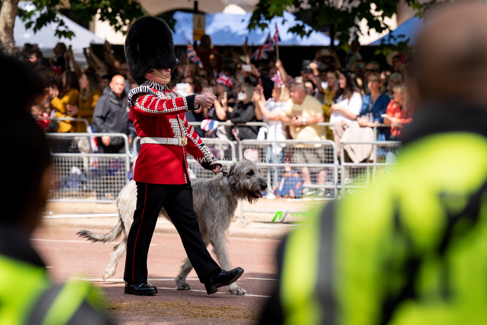 Solders take part in the parade down the mall before and after Trooping the Colour at Horse Guards Parade