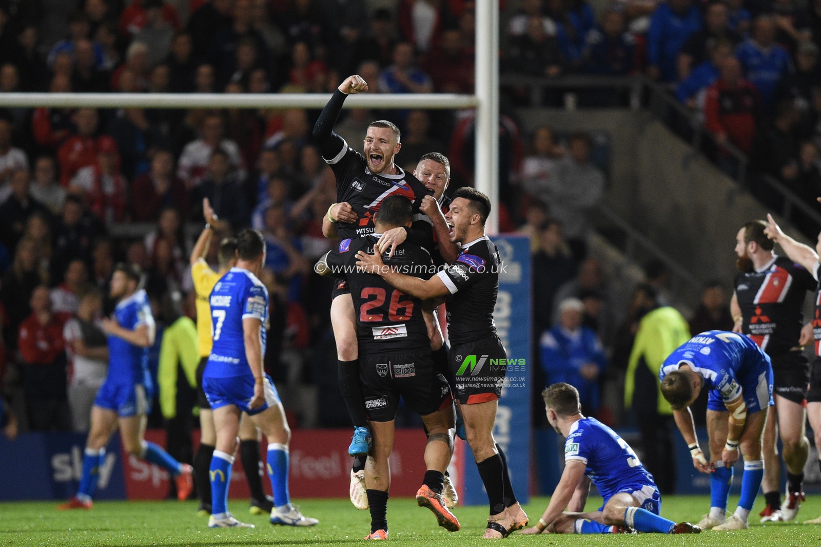 13th September 2019 ,  AJ Bell Stadium, Salford, England ;  Betfred Super League Rugby, Round 29, Salford Red Devils vs Hull KR ; Salford celebrate the golden point with Jackson Hastings and Niall Evalds jumping for joy

Credit: Richard Long/News Images