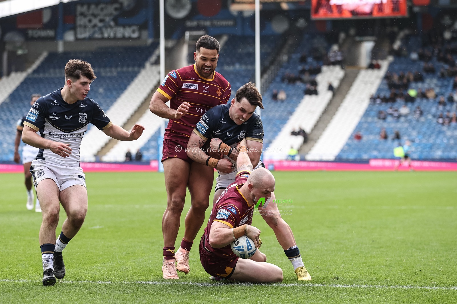 Adam Swift of Huddersfield Giants goes over for his fourth try to make it 48-6  during the Betfred Challenge Cup Sixth Round match Huddersfield Giants vs Hull FC at John Smith's Stadium, Huddersfield, United Kingdom, 23rd March 2024

(Photo by Mark Cosgrove/News Images)