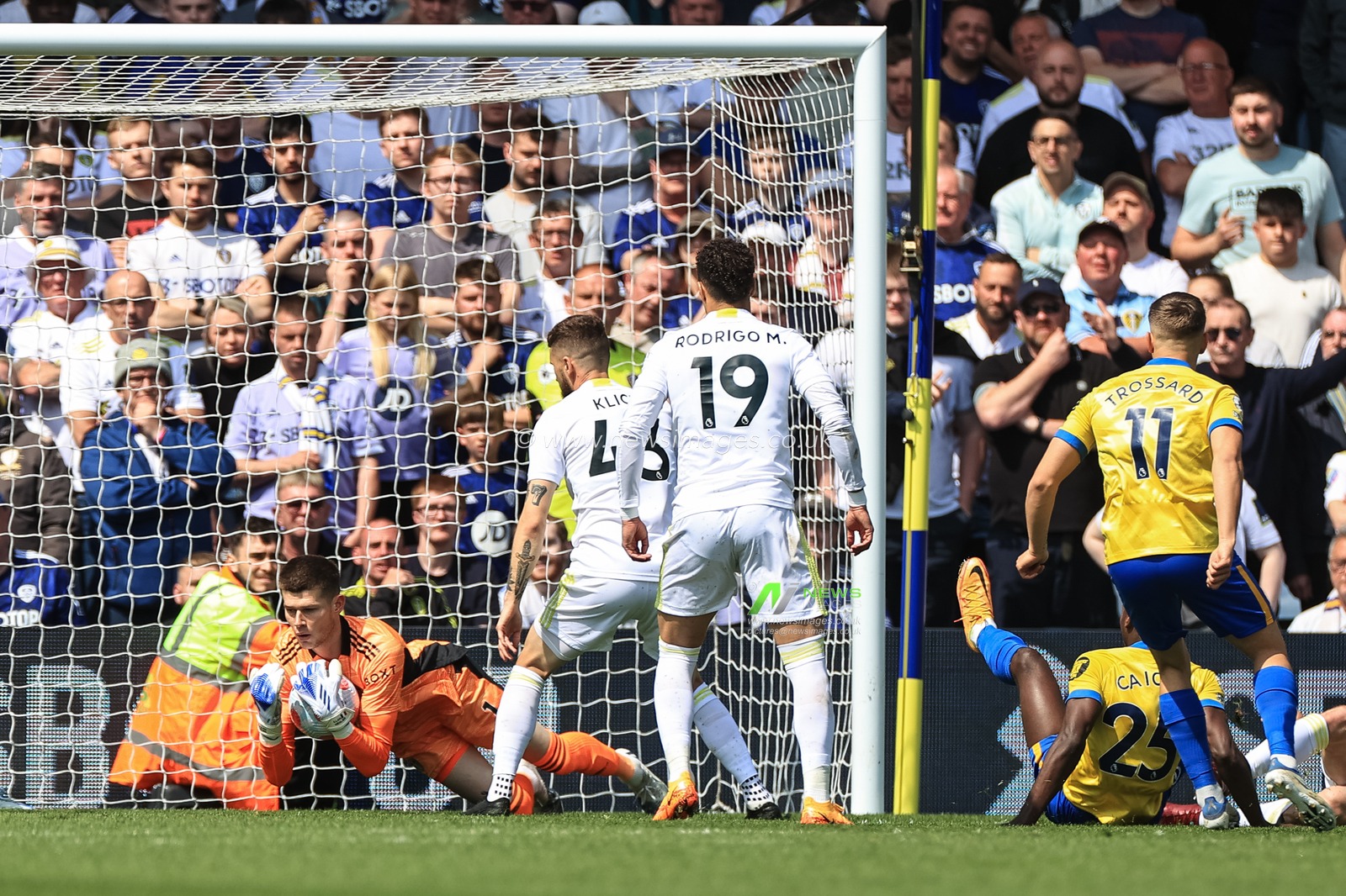 Illan Meslier #1 of Leeds United saves a shot from Moises Caicedo #25 of Brighton & Hove Albion