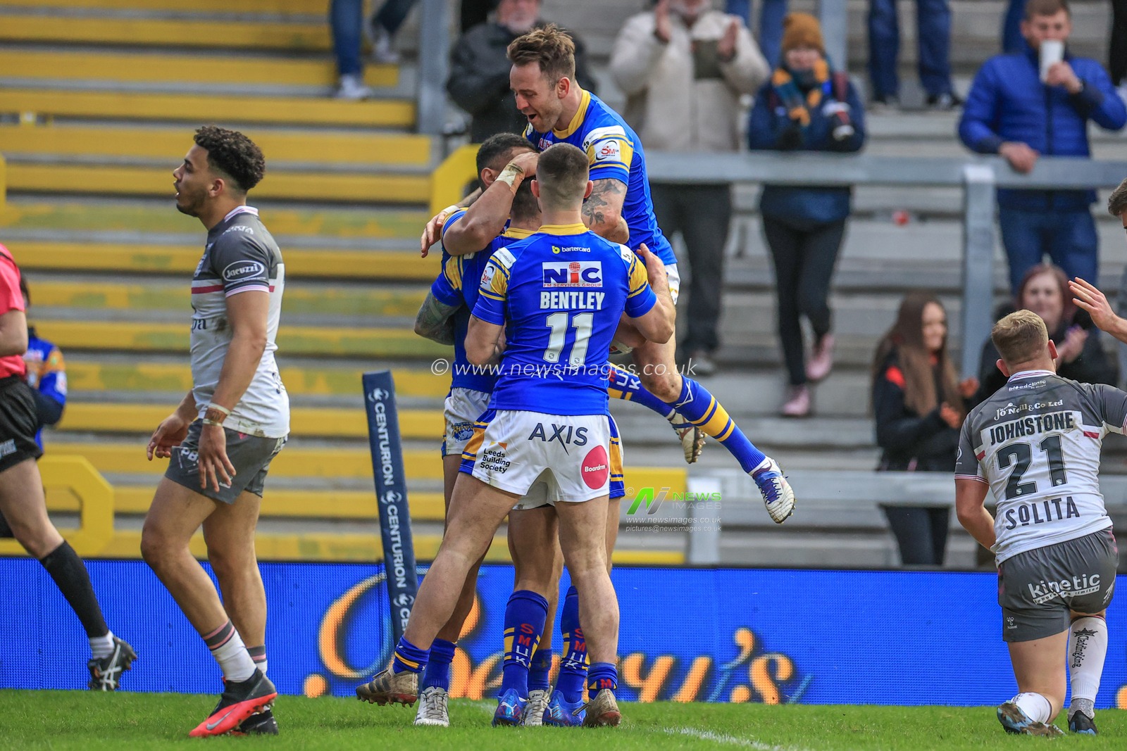 Tom Briscoe of Leeds Rhinos celebrates his try with team mates