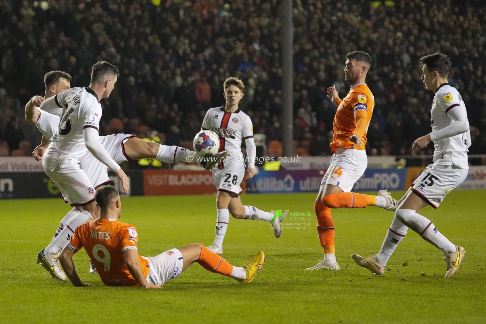 Jack Robinson #19 of Sheffield United clears the ball under pressure from Gary Madine #14 of Blackpool during the Sky Bet Championship match Blackpool vs Sheffield United at Bloomfield Road, Blackpool, United Kingdom, 29th December 2022

(Photo by Steve Flynn/News Images)