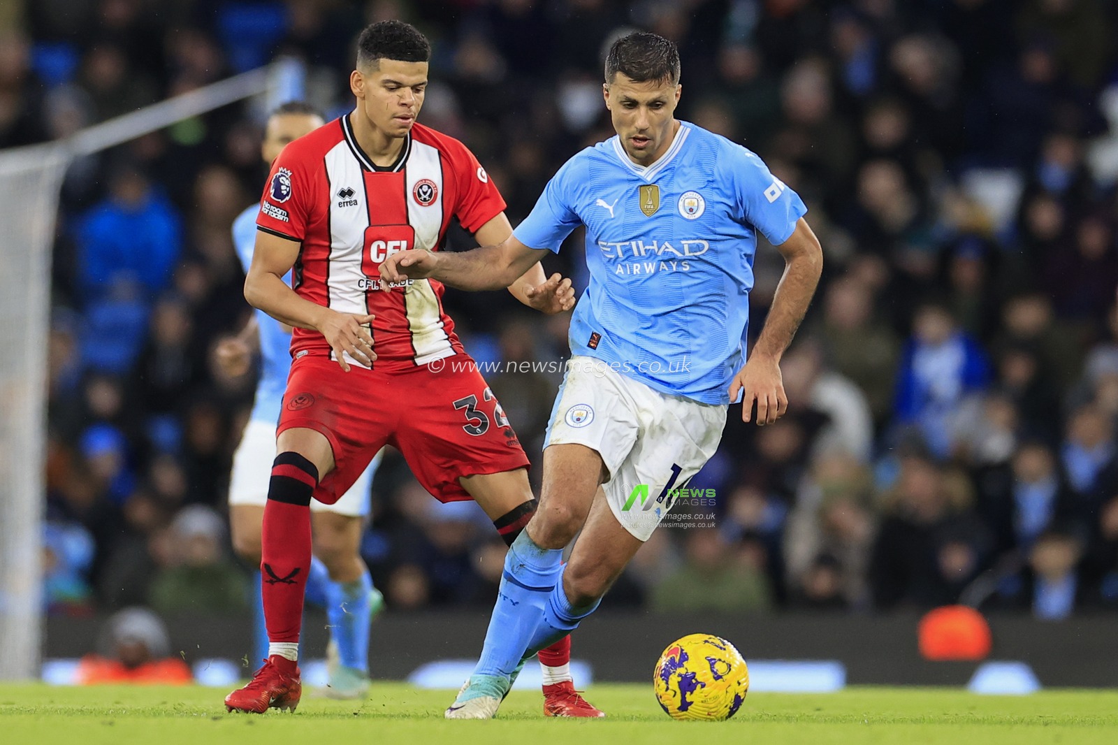 Rodrigo #16 of Manchester City runs from William Osula #32 of Sheffield United during the Premier League match Manchester City vs Sheffield United at Etihad Stadium, Manchester, United Kingdom, 30th December 2023

(Photo by Conor Molloy/News Images)