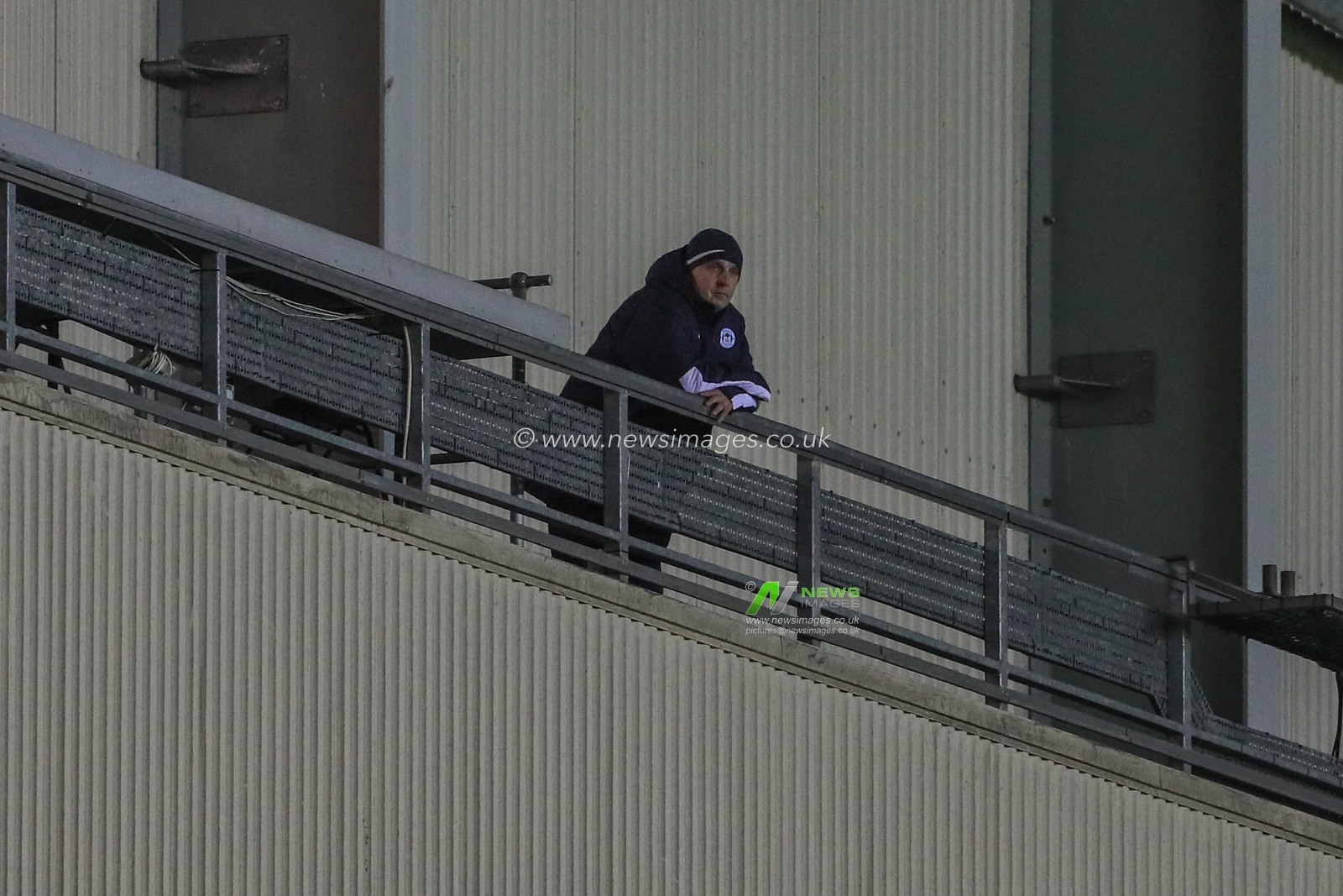 11th December 2019, DW Stadium, Wigan, England; Sky Bet Championship, Wigan Athletic v West Bromwich Albion : Paul Cook manager of Wigan Athletic watches the game from the gantry  

Credit: Mark Cosgrove/News Images