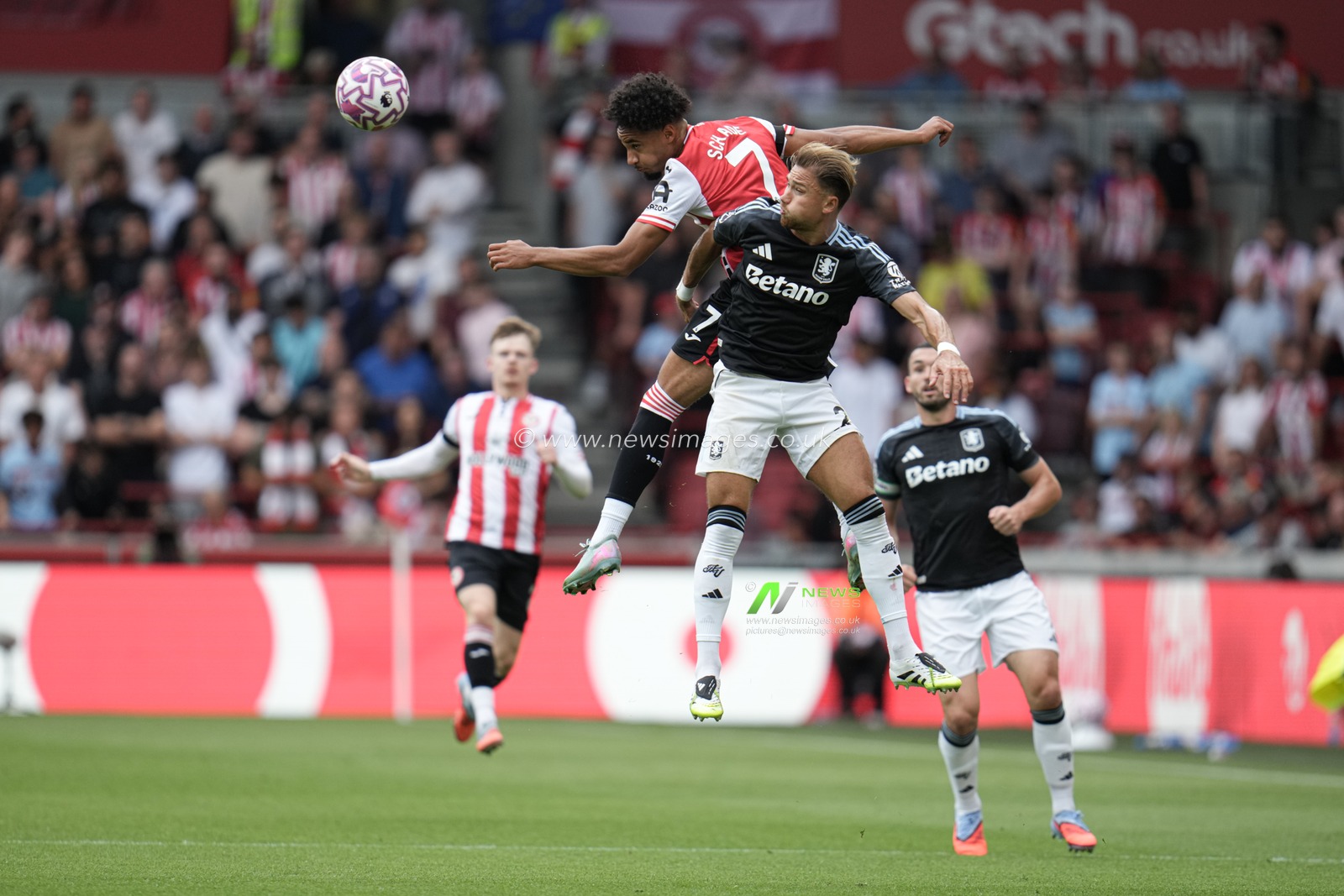 Kevin Schade of Brentford and Matty Cash of Aston Villa battle for header during the Premier League match Brentford vs Aston Villa at The Gtech Community Stadium, London, United Kingdom, 23rd August 2025

(Photo by Harvey Murphy/News Images)