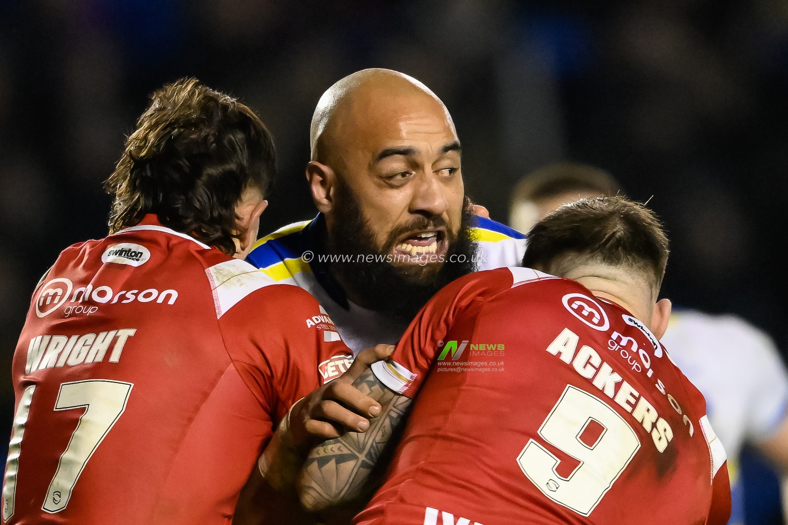 Sam Kasiano #14 of Warrington Wolves is tackled by Andy Ackers #9 of Salford Red Devils during the Betfred Super League Round 3 match Warrington Wolves vs Salford Red Devils at Halliwell Jones Stadium, Warrington, United Kingdom, 2nd March 2023

(Photo by Craig Thomas/News Images)