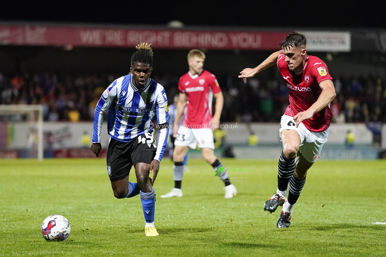 Alex Mighten of Sheffield Wednesday runs past Ryan Delaney of Morecambe during the Sky Bet League 1 match Morecambe vs Sheffield Wednesday at Mazuma Stadium, Morecambe, United Kingdom, 13th September 2022

(Photo by Steve Flynn/News Images)