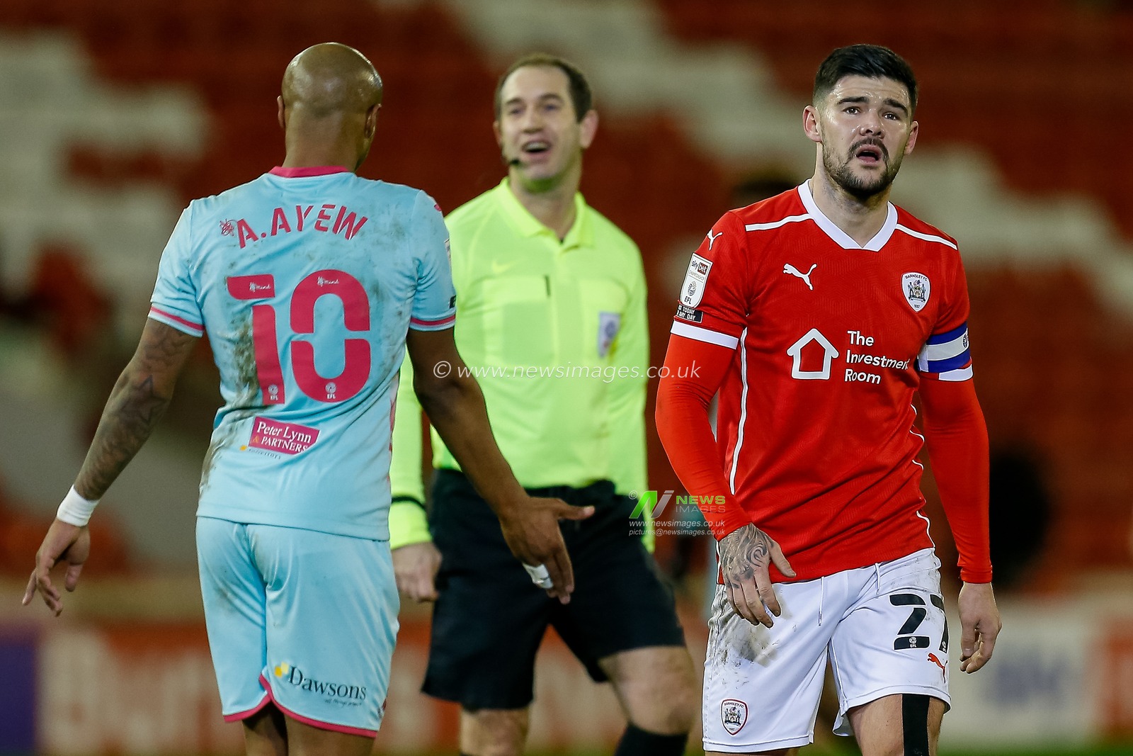 Alex Mowatt #27 of Barnsley walks off the pitch at half time
