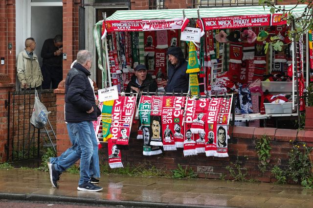 Fans check out the scarfs on sale as they make their way to the game during the Premier League match Manchester United vs Nottingham Forest at Old Trafford, Manchester, United Kingdom on 17 May 2026

(Photo by Mark Cosgrove/News Images)
