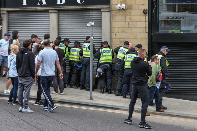 Protestors are detained by the police during an anti-racism protest, Barnsley, United Kingdom, 8th August 2024