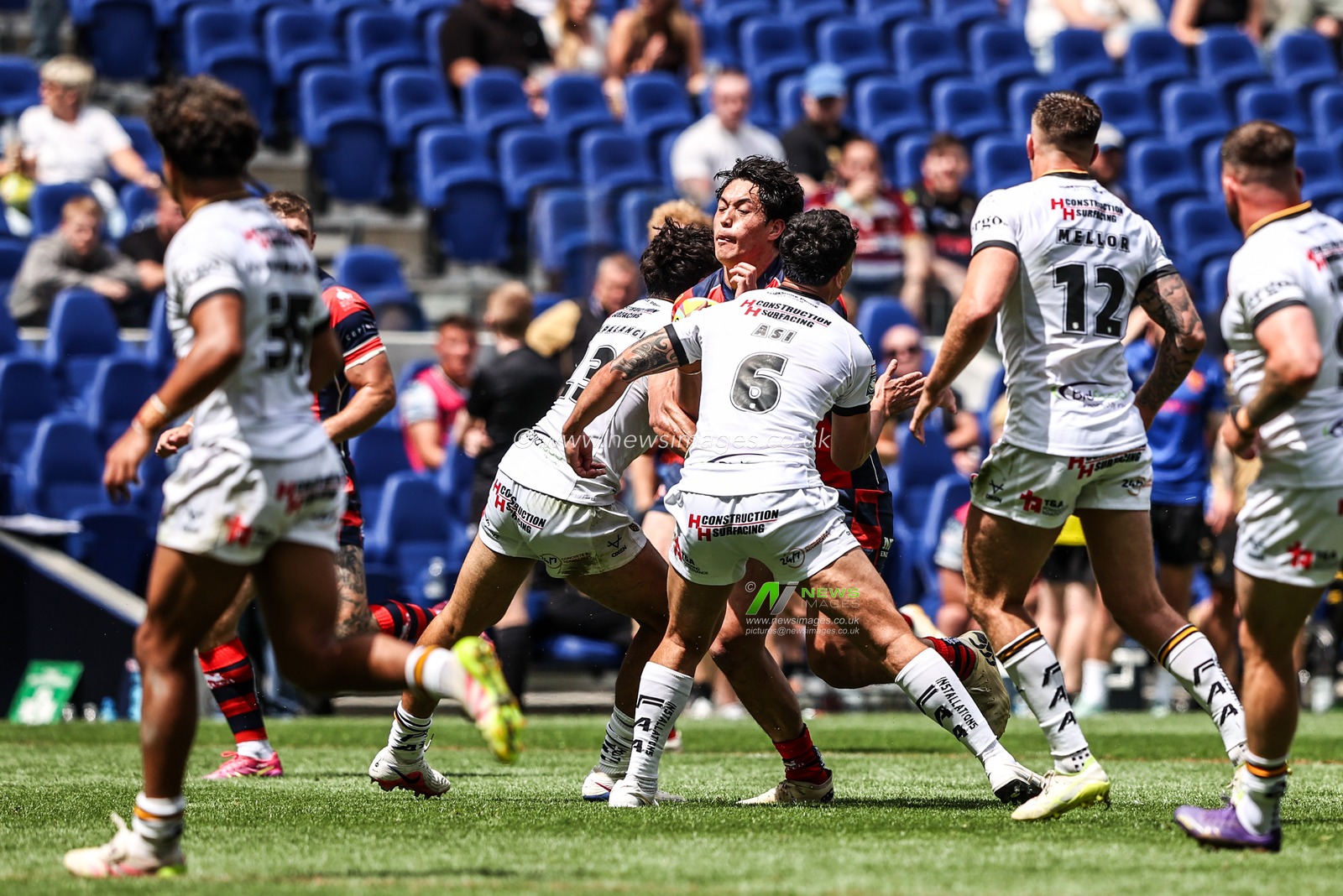 Isaiah Vagana of Wakefield Trinity is tackled by Krystian Mapapalangi of Castleford Tigers and Daejarn Asi of Castleford Tigers during the Betfred Super League Magic Weekend match Wakefield Trinity vs Castleford Tigers at Hill Dickinson Stadium, Liverpool, United Kingdom on 05 July 2026

(Photo by Alfie Cosgrove/News Images)