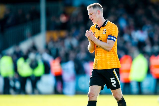 Michael Morrison of Cambridge United acknowledges the fans after the teams defeat following the Sky Bet League 1 match Cambridge United vs Peterborough United at Cledara Abbey Stadium, Cambridge, United Kingdom, 15th March 2025

(Photo by Izzy Poles/News Images)