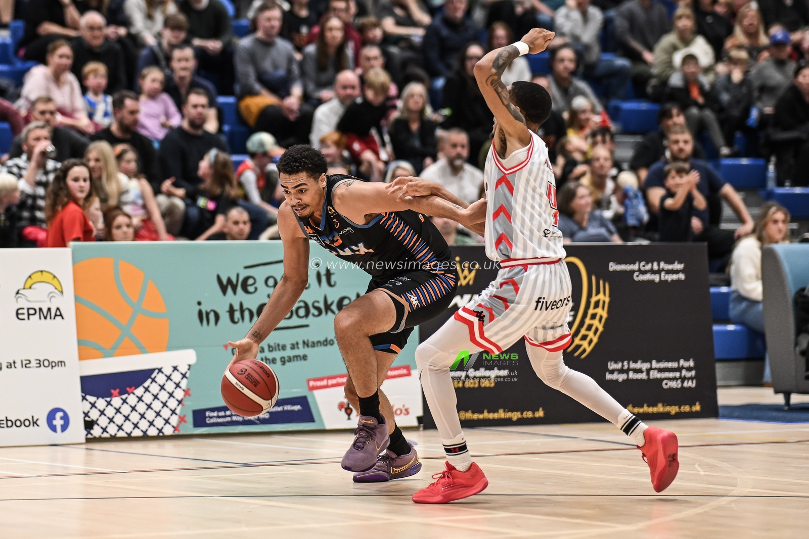 Ethan Chargois of Cheshire Phoenix drives past Xavier Pinson of Leicester Riders during the British Basketball Championship match Cheshire Phoenix vs Leicester Riders at Ellesmere Port Sports Village, Ellesmere Port, United Kingdom, 12th November 2023

(Photo by Craig Thomas/News Images)