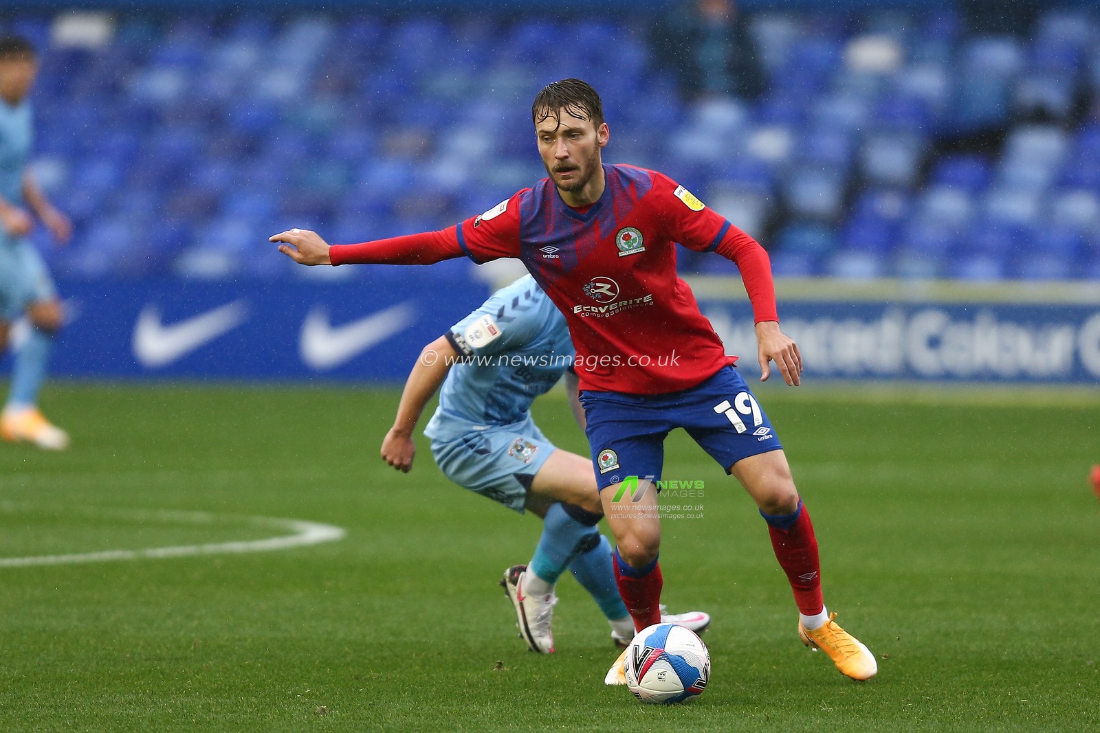 Tom Trybull (19) of Blackburn Rovers protects the ball