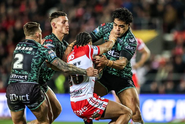 Joe Ofahengaue of Leigh Leopards is tackled by Lewis Murphy of St Helens during the Betfred Super League match St Helens vs Leigh Leopards at The BrewDog Stadium, St Helens, United Kingdom on 20 February 2026

(Photo by Alfie Cosgrove/News Images)