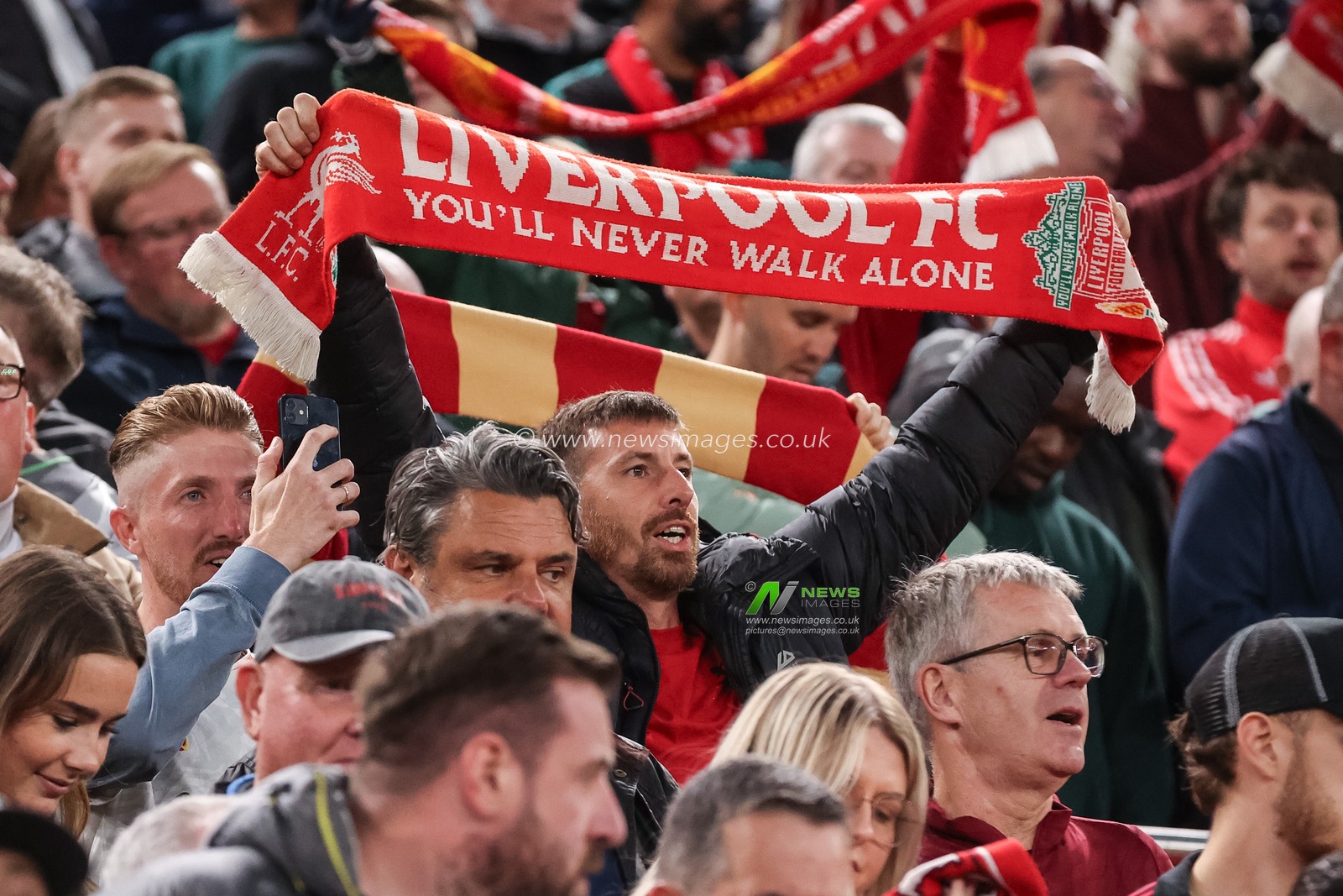 Liverpool fans hold their scarfs above their head as they sing "You'll Never Walk Alone" during the UEFA Champions League Matchday 1 of 8 match Liverpool vs Atletico Madrid at Anfield, Liverpool, United Kingdom on 09 September 2026

(Photo by Alfie Cosgrove/News Images)