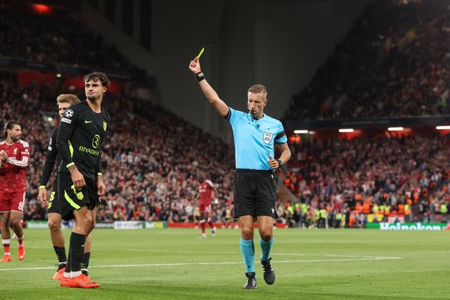 Referee Davide Massa gives a yellow card to Marc Pubill of Atlético Madrid during the UEFA Champions League Matchday 1 of 8 match Liverpool vs Atletico Madrid at Anfield, Liverpool, United Kingdom on 09 September 2026

(Photo by Alfie Cosgrove/News Images)