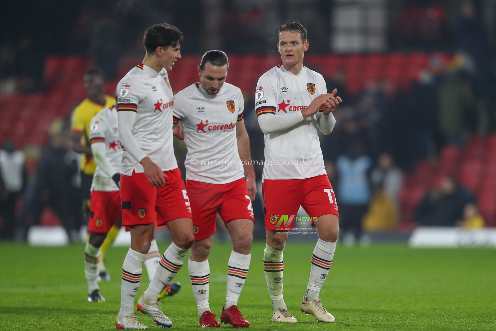 Sean McLoughlin #17 of Hull City (far right) applauds the travelling fans after the Sky Bet Championship match Watford vs Hull City at Vicarage Road, Watford, United Kingdom, 11th December 2022

(Photo by Gareth Evans/News Images)