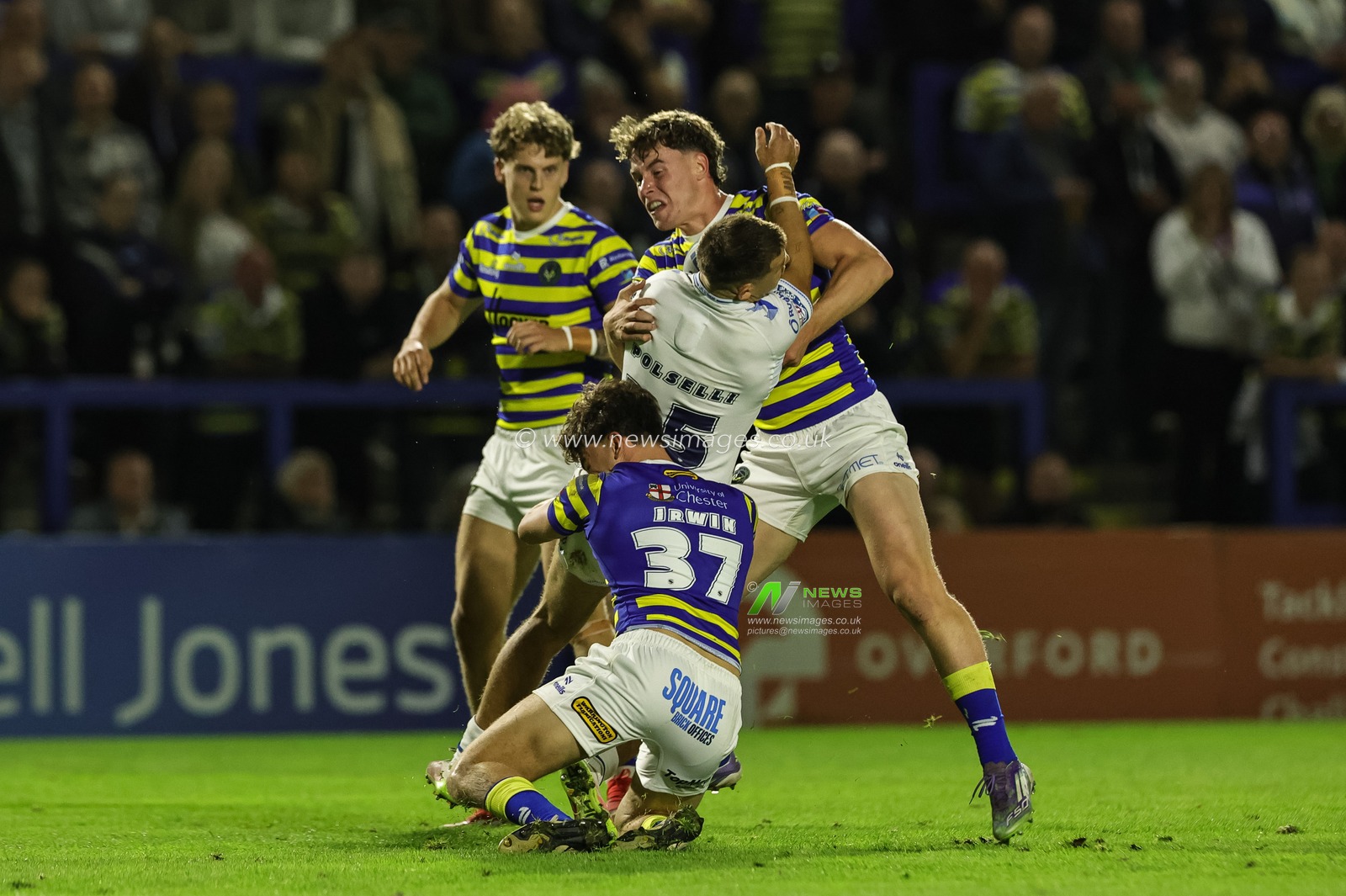 Luke Polselli of Toulouse Olympique is tackled by Ewan Smith of Warrington Wolves and Patrick Irwin of Warrington Wolves during the Betfred Super League round 27 match Warrington Wolves vs Toulouse Olympique at The Halliwell Jones Stadium, Warrington, United Kingdom on 11 September 2026

(Photo by Mark Cosgrove/News Images)