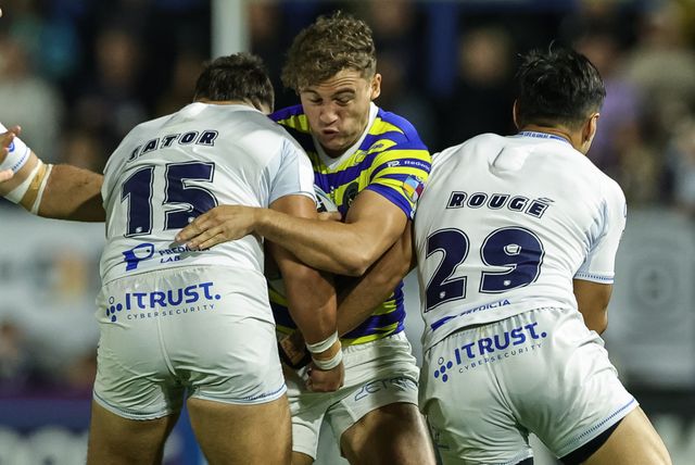 Cai Taylor-Wray of Warrington Wolves is tackled by Joe Cator of Toulouse Olympique and César Rougé of Toulouse Olympique during the Betfred Super League round 27 match Warrington Wolves vs Toulouse Olympique at The Halliwell Jones Stadium, Warrington, United Kingdom on 11 September 2026

(Photo by Mark Cosgrove/News Images)