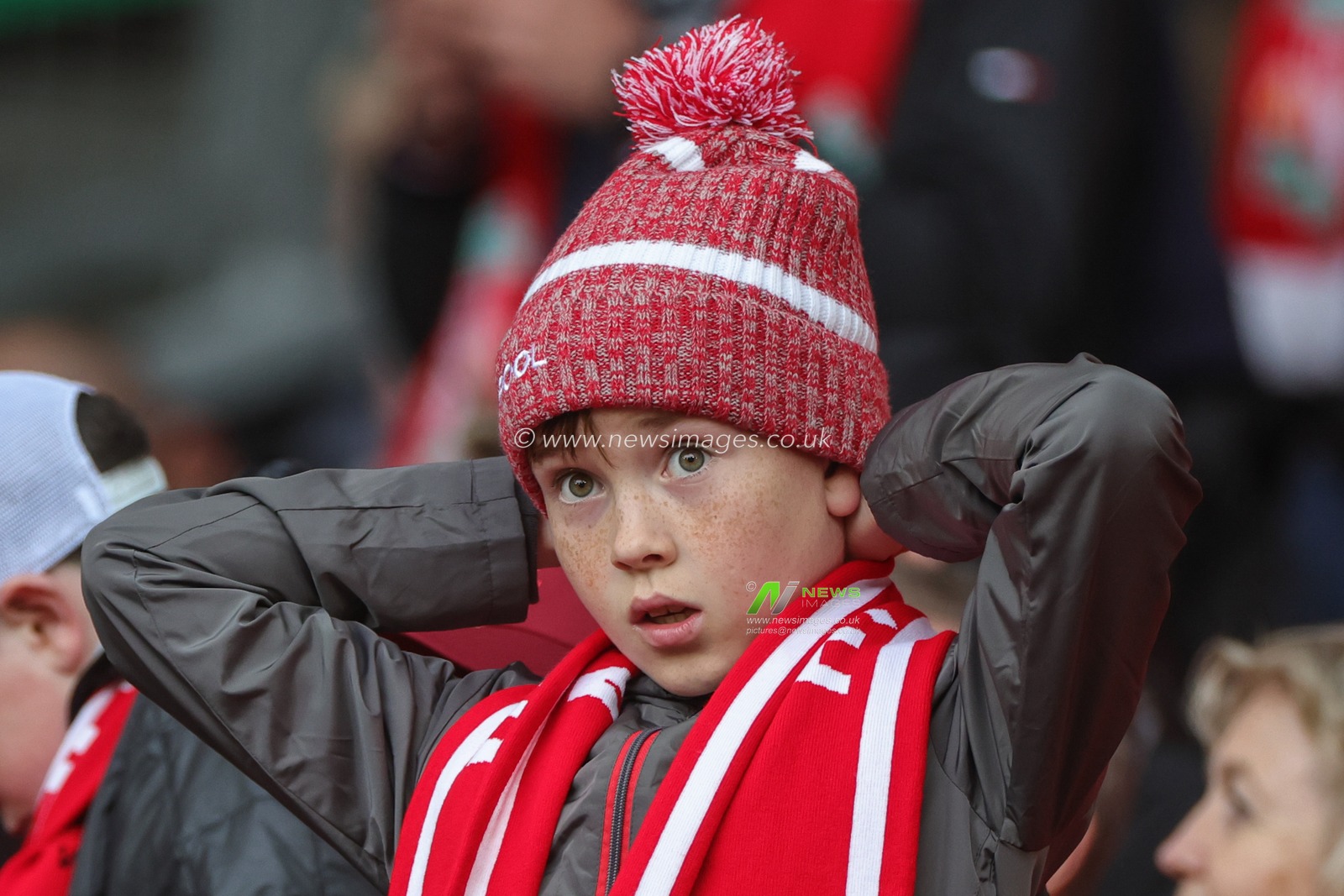 A young Liverpool fan arrives ahead of the Premier League match Liverpool vs Fulham at Anfield, Liverpool, United Kingdom, 3rd May 2023

(Photo by Mark Cosgrove/News Images)